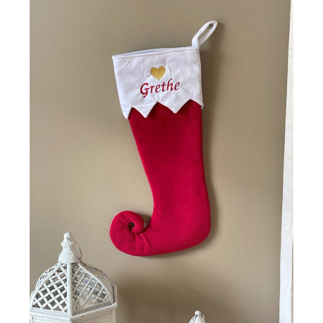 Rød julestrømpe med rensdyr og navn på